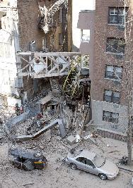 A construction Crane, as it had fallen on a residential Building in NYC on Saturday, killing several.  Photo from Toronto's Globe and Mail